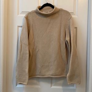 Everyone’s favorite tan cotton roll neck sweater!